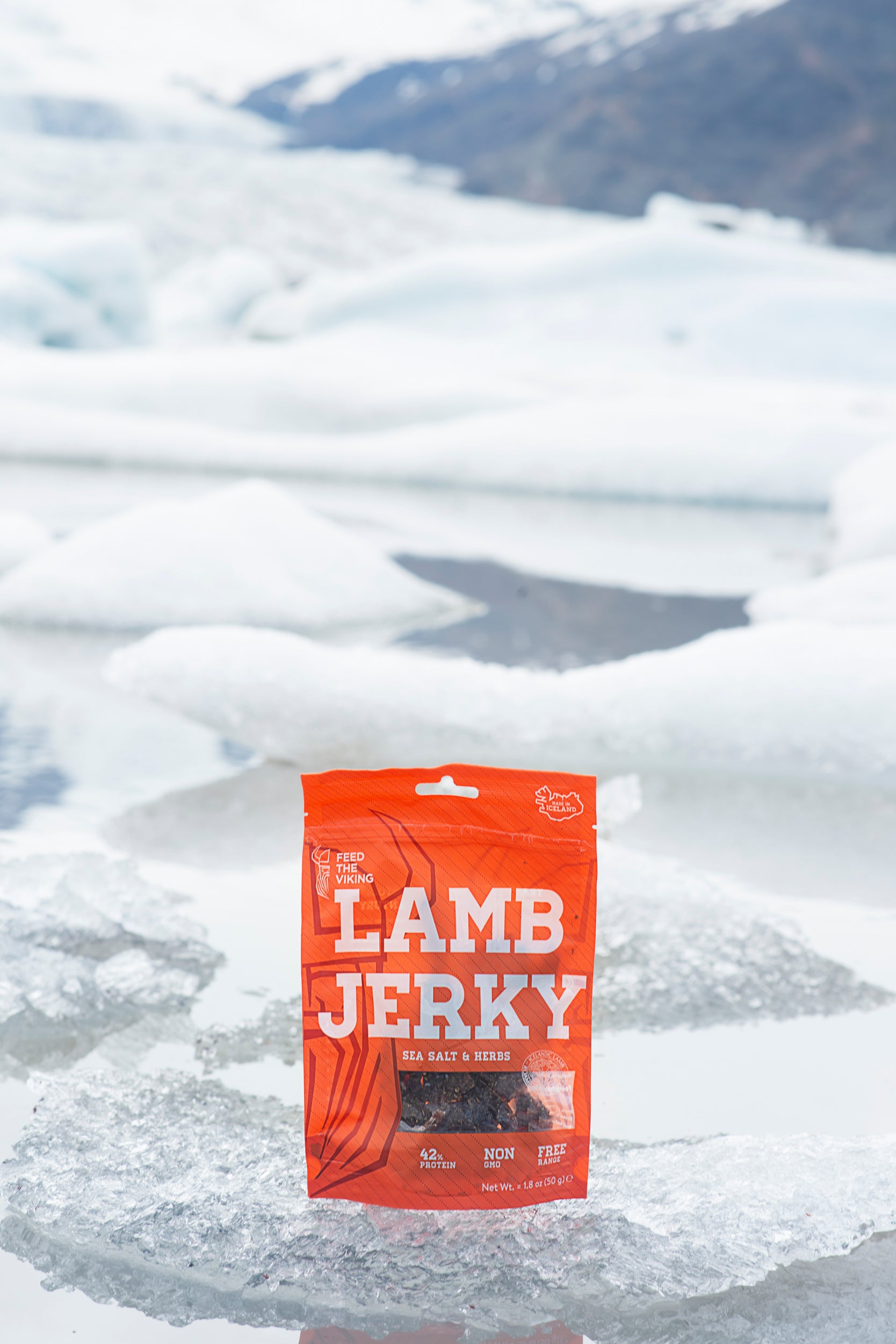 Feed the Viking Lamb Jerky resting on a glacier with a shimmering Icelandic glacier in the background—fuel for real Viking terrain.